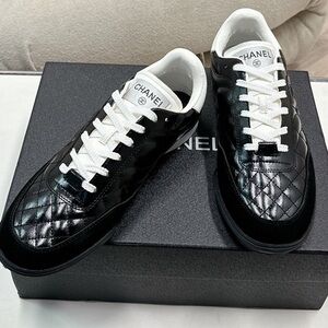Women's Chanel Black Quilted Patent Leather White Lace-Up Sneakers